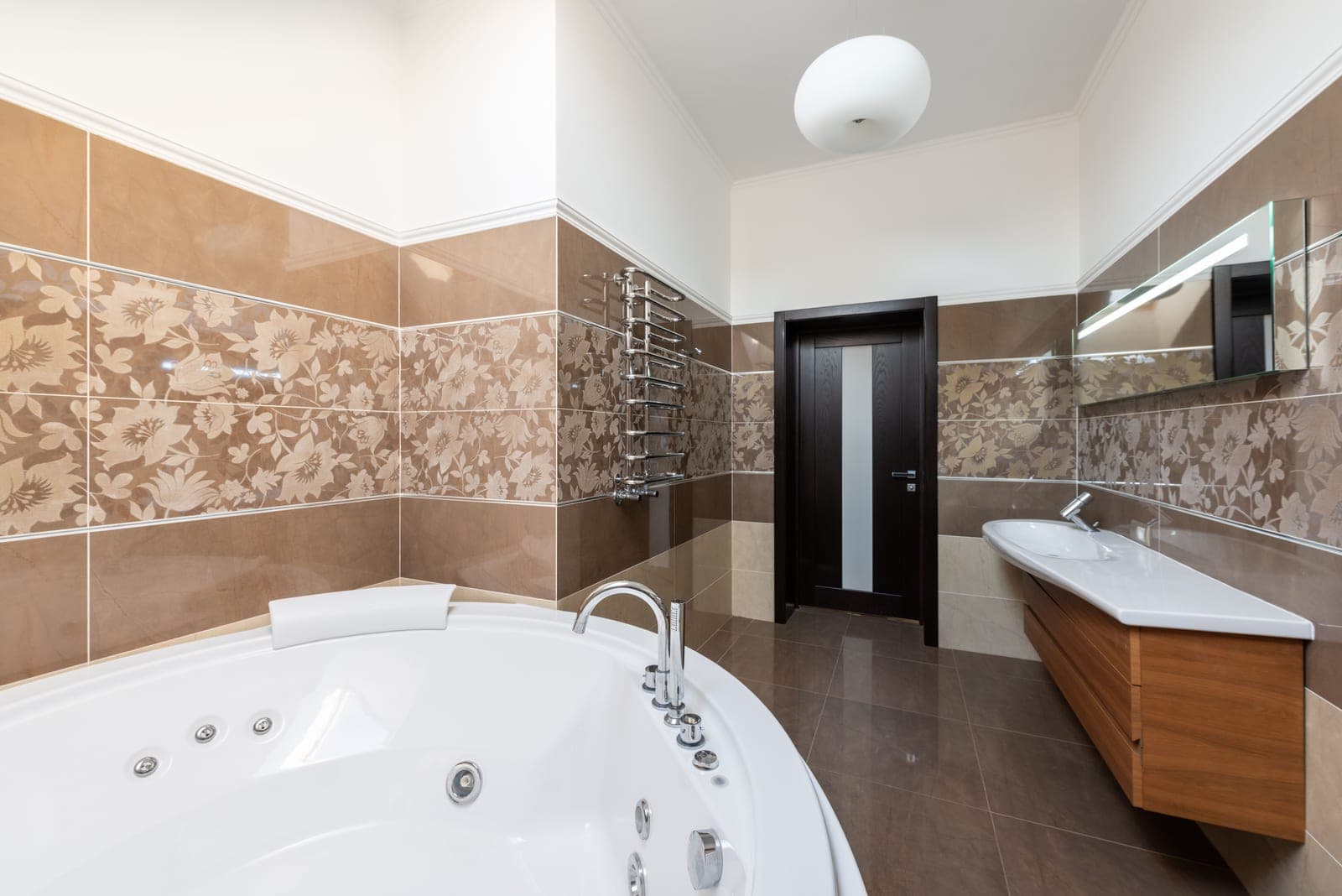 A bathtub in a plain modern bathroom