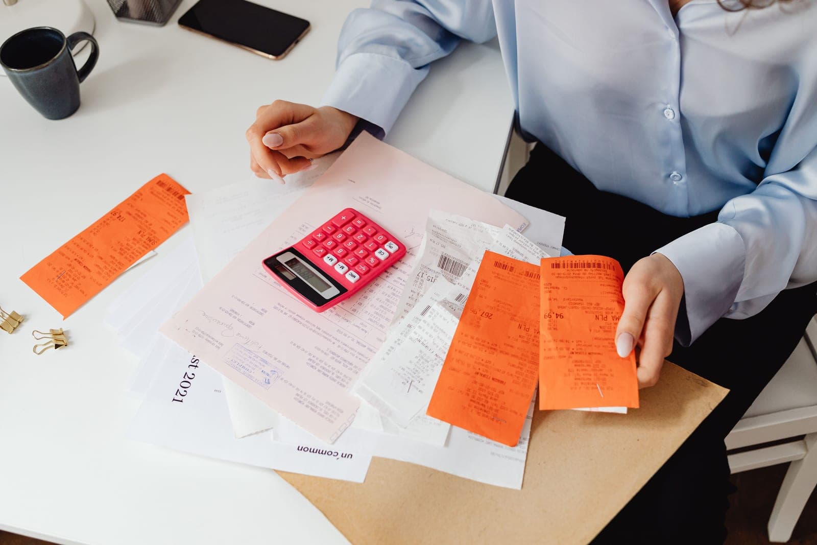 A power bill and a calculator on a desk