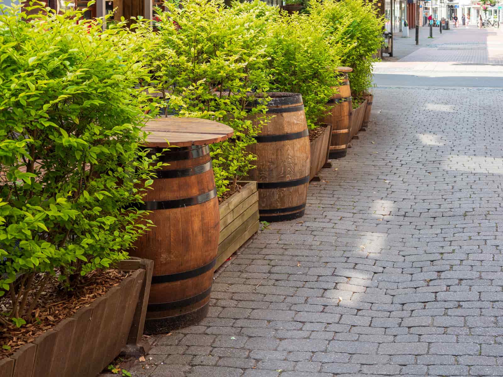 A wooden barrel tub standing in a garden
