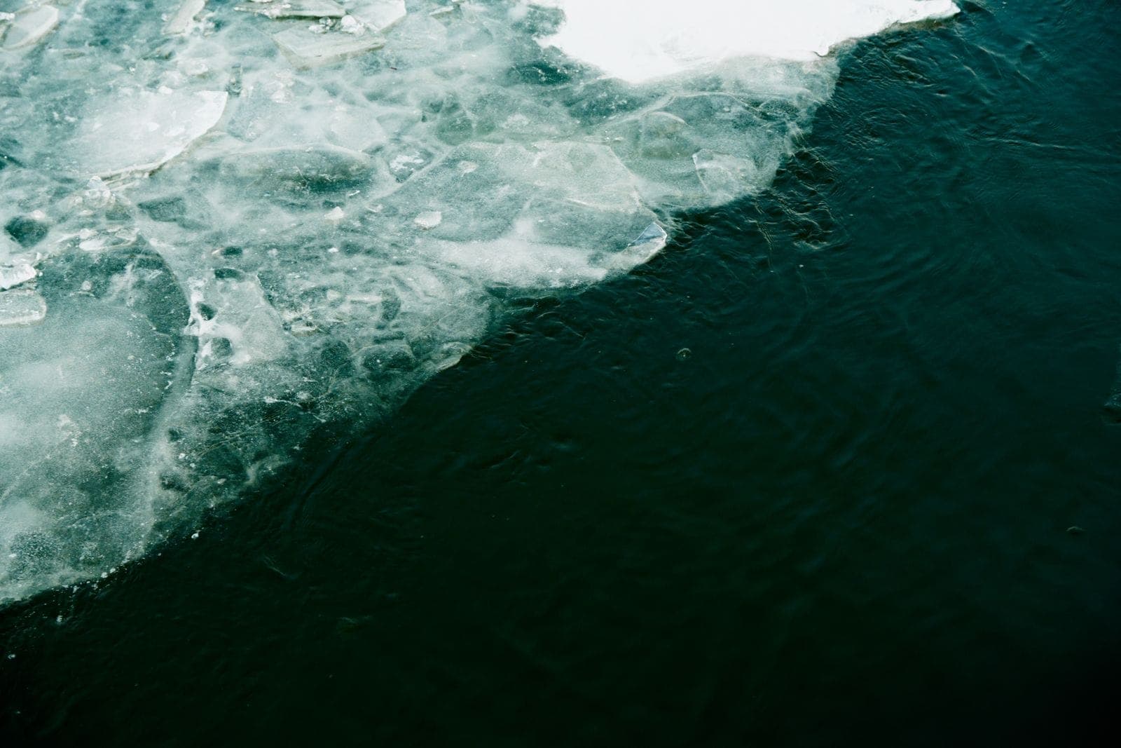 Broken ice meeting dark open water