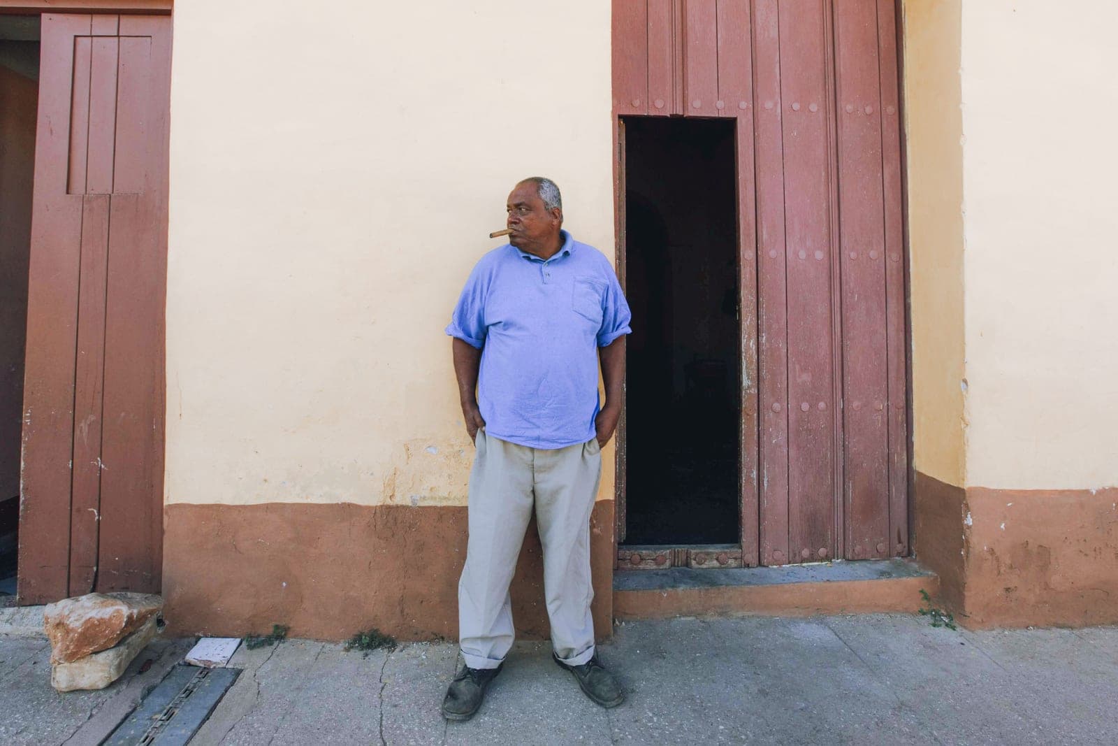 A tall person standing beside a doorway for scale