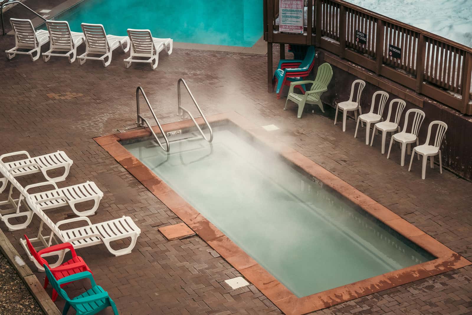 An outdoor hot tub with steam rising off the water