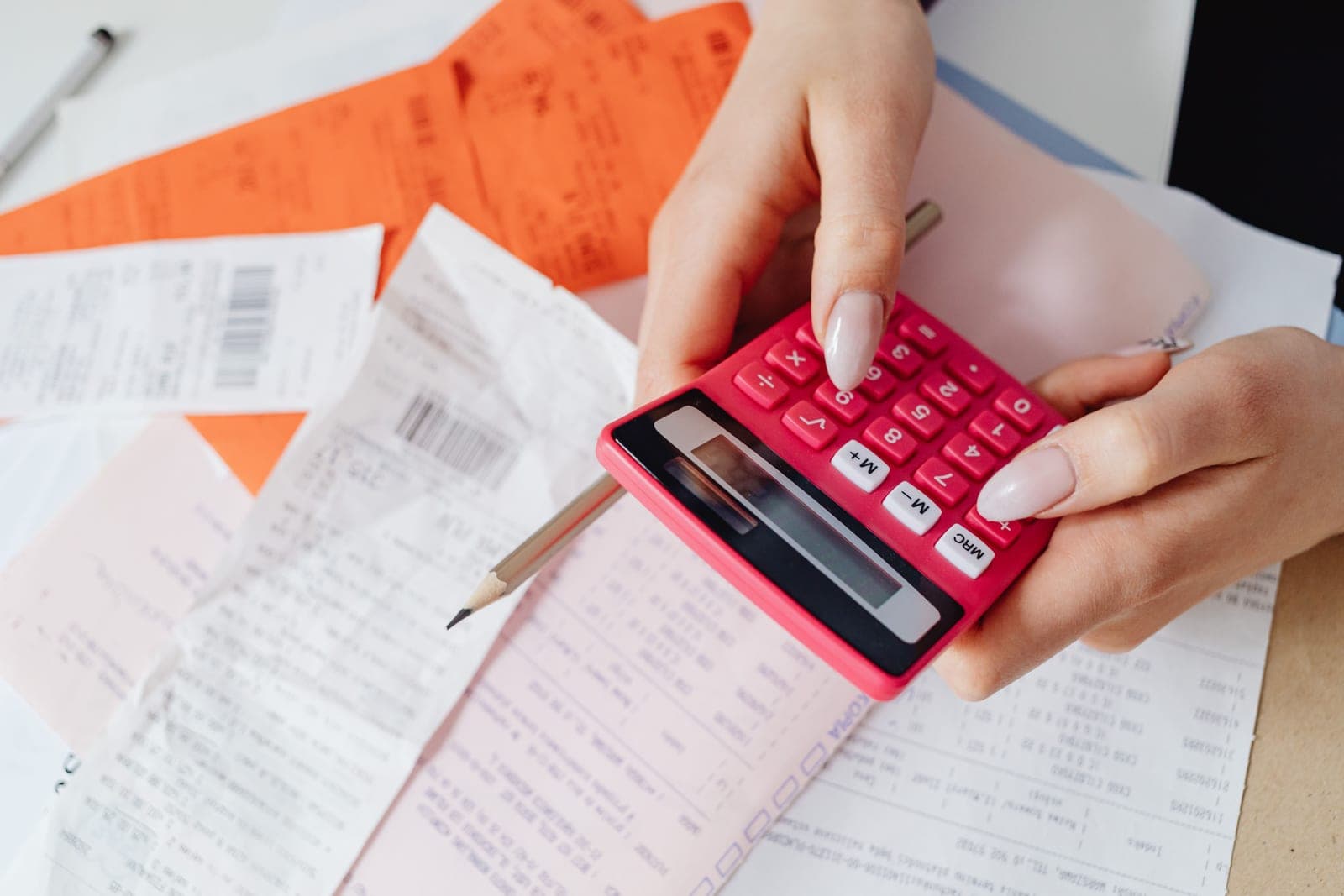 An electricity bill and a calculator on a desk