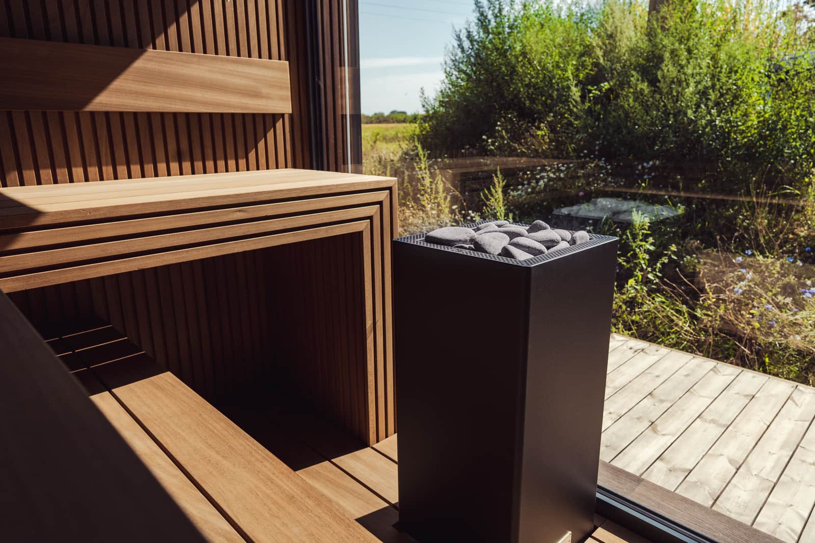A small home sauna set up in the corner of an ordinary room