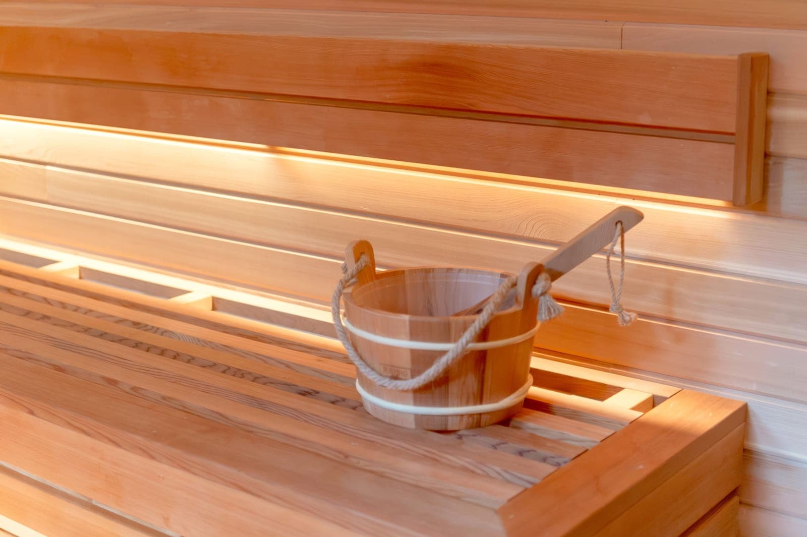 An infrared sauna blanket unfolded on a plain surface